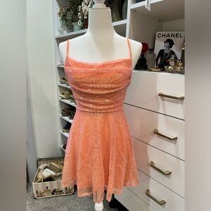 Coral colored flirty sequin dress
